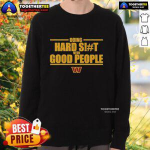Official Washington Commanders sweatshirt featuring 'Doing Hard Shit With Good People' design, perfect for fans.