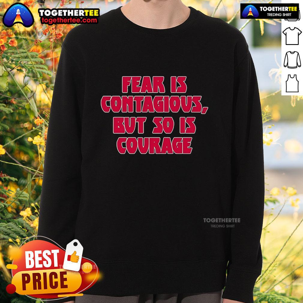 James B. Jones wearing 'Fear Is Contagious, But So Is Courage' sweatshirt, showcasing empowering message on courage.
