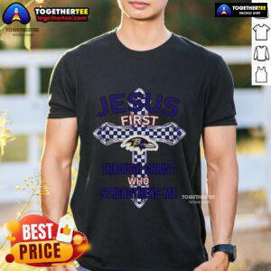 Top Baltimore Ravens 'Jesus First Through Christ Who Strengthens Me' T-Shirt featuring team colors and inspirational design.