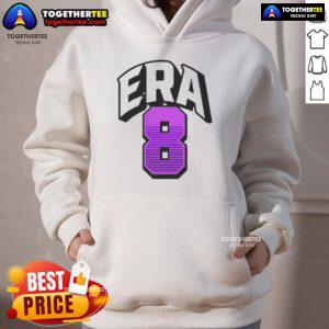Lamar Jackson wearing an Era 8 hoodie, showcasing his style and athleticism on the field.