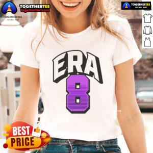 Alt Text: Lamar Jackson wearing an Era8 ladies tee, showcasing stylish sports apparel for fans and fashion lovers.