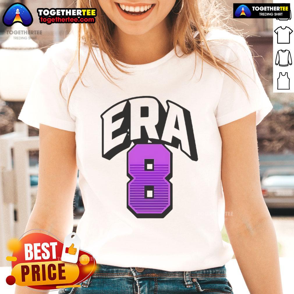 Alt Text: Lamar Jackson wearing an Era8 ladies tee, showcasing stylish sports apparel for fans and fashion lovers.