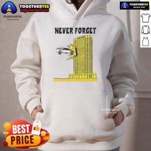 Tesla Cybertruck crashed into Trump building, featured on a trendy hoodie, showcasing a unique and humorous design.