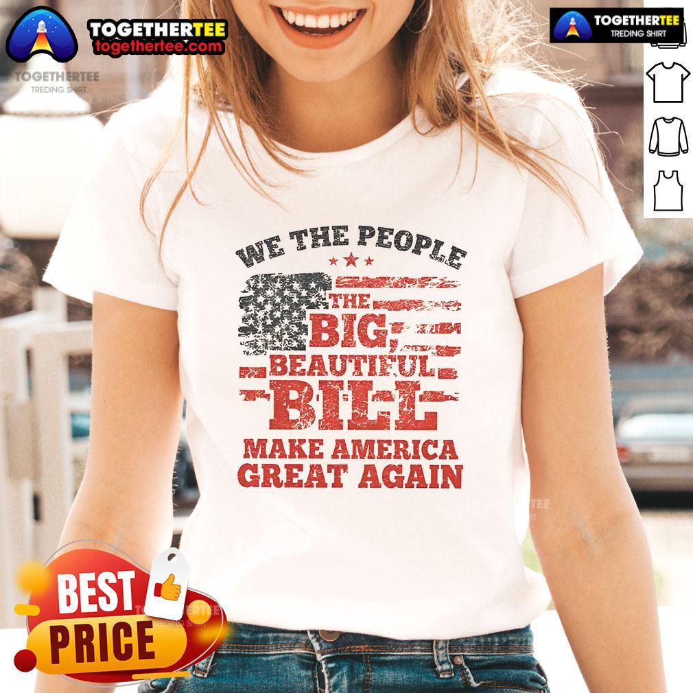 Good We The People Big Beautiful Bill Make America Great Again flag graphic on a ladies tee shirt.