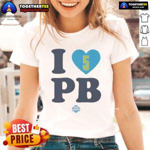 Happy Paige Bueckers wearing 'I Love PB' Dallas Wings ladies tee, showcasing her support for women's basketball fashion.
