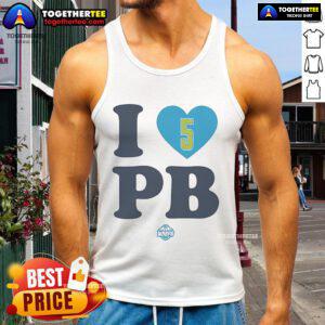 Happy Paige Bueckers wearing an 'I Love PB' Dallas Wings tank top, showcasing her love for basketball and team spirit.