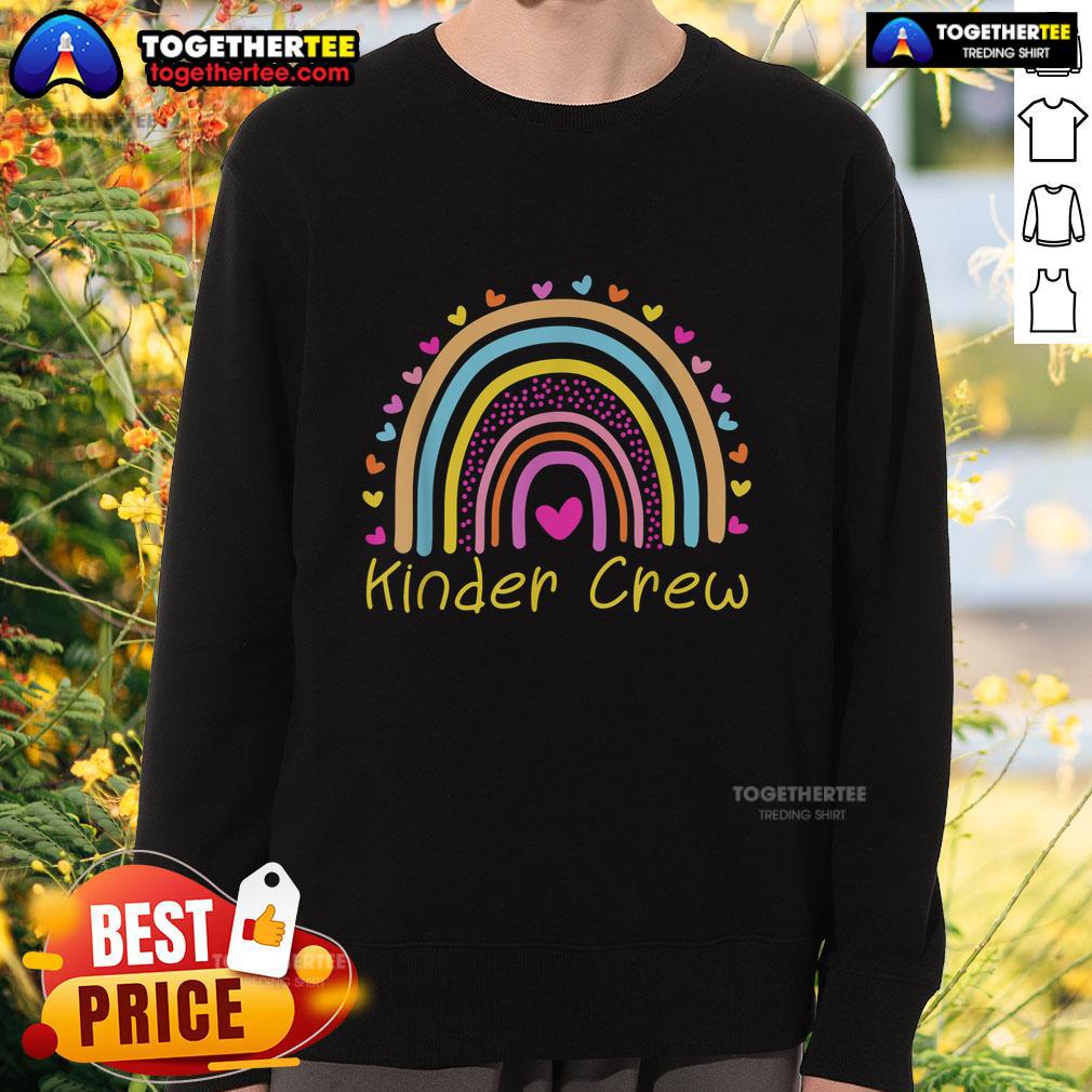 Alt Text: Kindergarten teacher wearing a Nice Kinder Crew rainbow heart sweatshirt, promoting a positive classroom vibe.