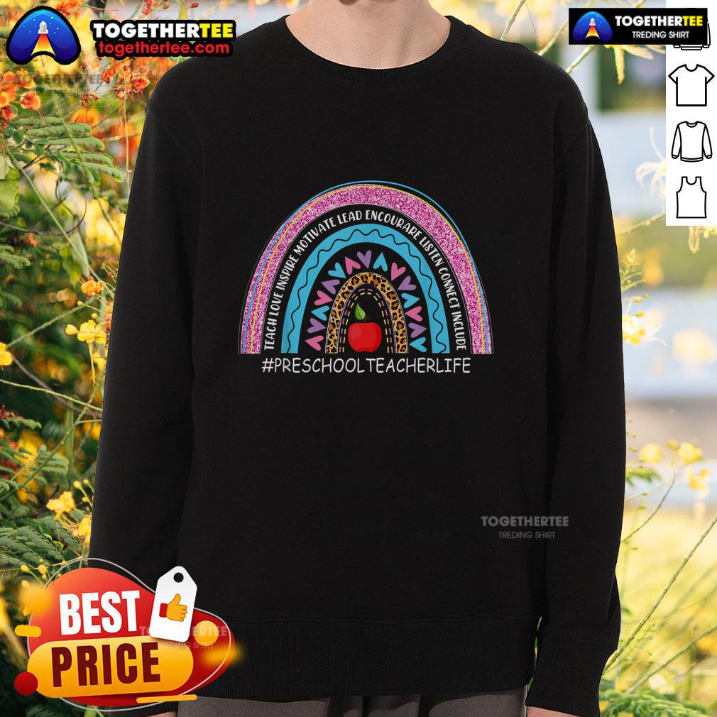 Nice preschool teacher wearing a rainbow sweatshirt that says 'Love, Inspire, Lead, Motivate' for a cheerful classroom vibe.