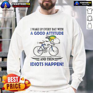 Alt Text: Funny Snoopy sweatshirt with 'I wake up every day with a good attitude, then idiots happen' slogan.
