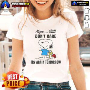 Alt Text: Snoopy 'Nope, Still Don't Care, Try Again Tomorrow' graphic on a ladies tee, perfect for casual wear and Snoopy fans.