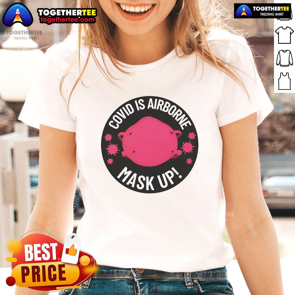 Official Covid Is Airborne Mask Up logo on a stylish ladies tee, promoting health awareness and safety.