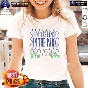 Olivia Rodrigo in the park wearing the official Hop The Fence ladies tee, showcasing her stylish music-inspired fashion.
