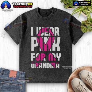 Alt Text: Pretty I Wear Pink for My Grandma Breast Cancer Awareness washed t-shirt displayed on a wooden background.