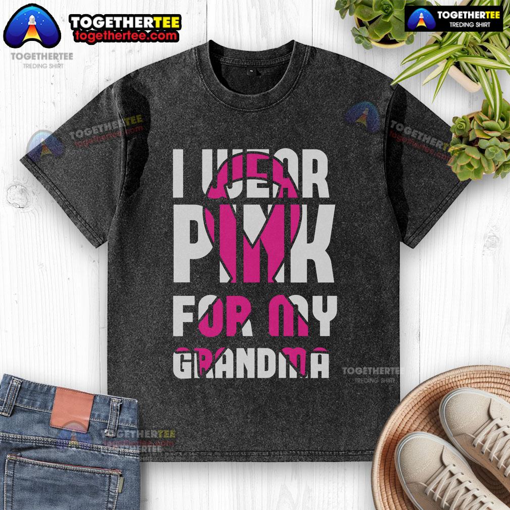 Alt Text: Pretty I Wear Pink for My Grandma Breast Cancer Awareness washed t-shirt displayed on a wooden background.