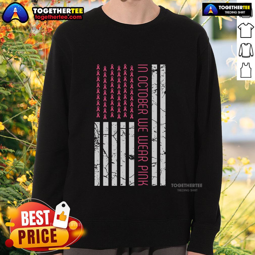 Pretty in October: Women wearing pink America flag sweatshirt for Breast Cancer Awareness Month.