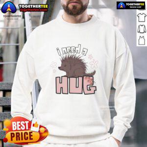 Funny porcupine graphic on a cozy sweatshirt with 'I Need A Hug' text for animal lovers and humor enthusiasts.