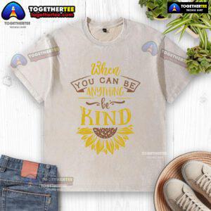 Happy When You Can Be Anything Be Kind Sunflower Washed T-Shirt displayed on a hanger, showcasing its vibrant design.