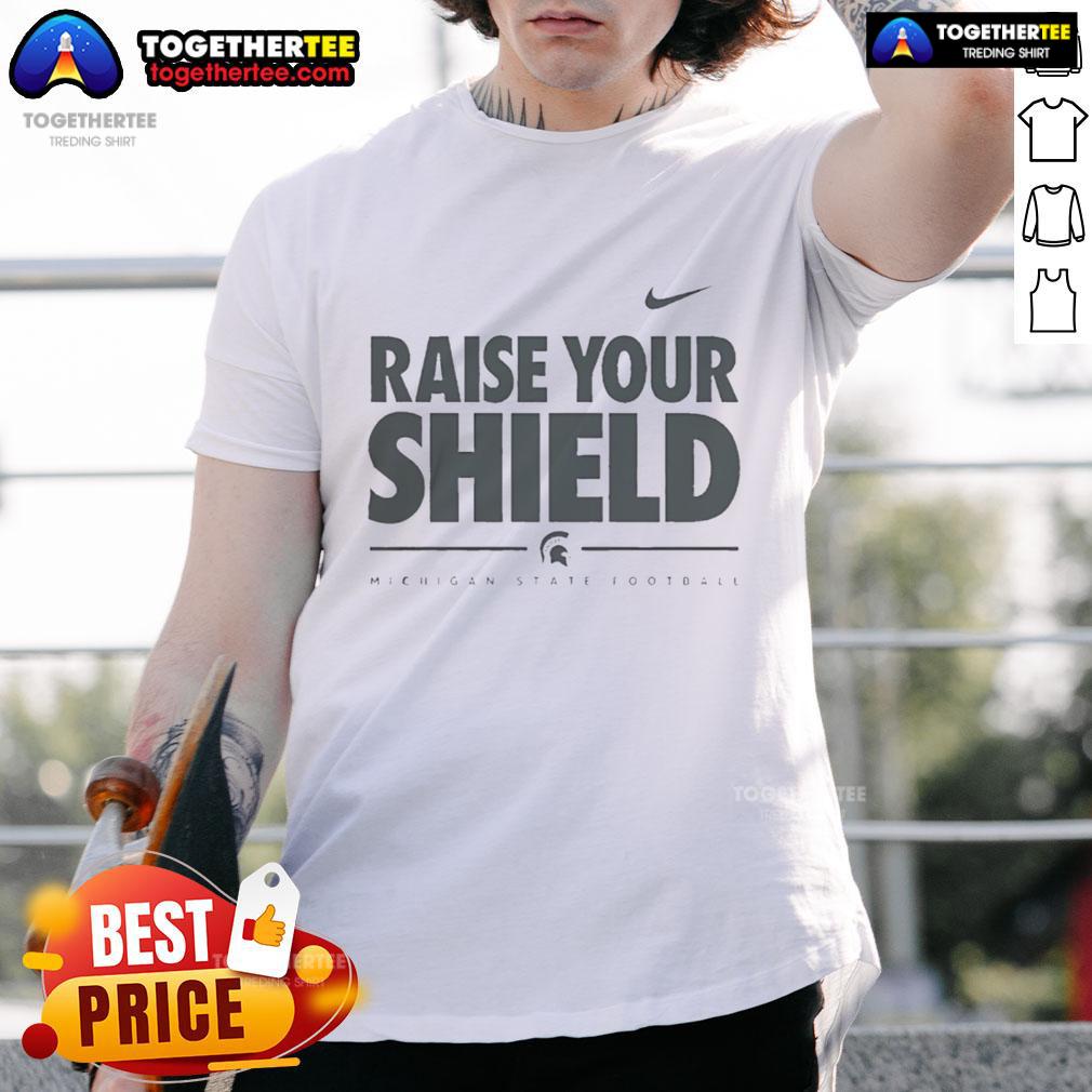 Official Michigan State Spartans Raise Your Shield T-Shirt featuring bold team graphics and vibrant green color.