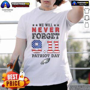 Official We Will Forget 9/11 Patriot Day Philadelphia Eagles T-Shirt featuring a bold design and team colors.