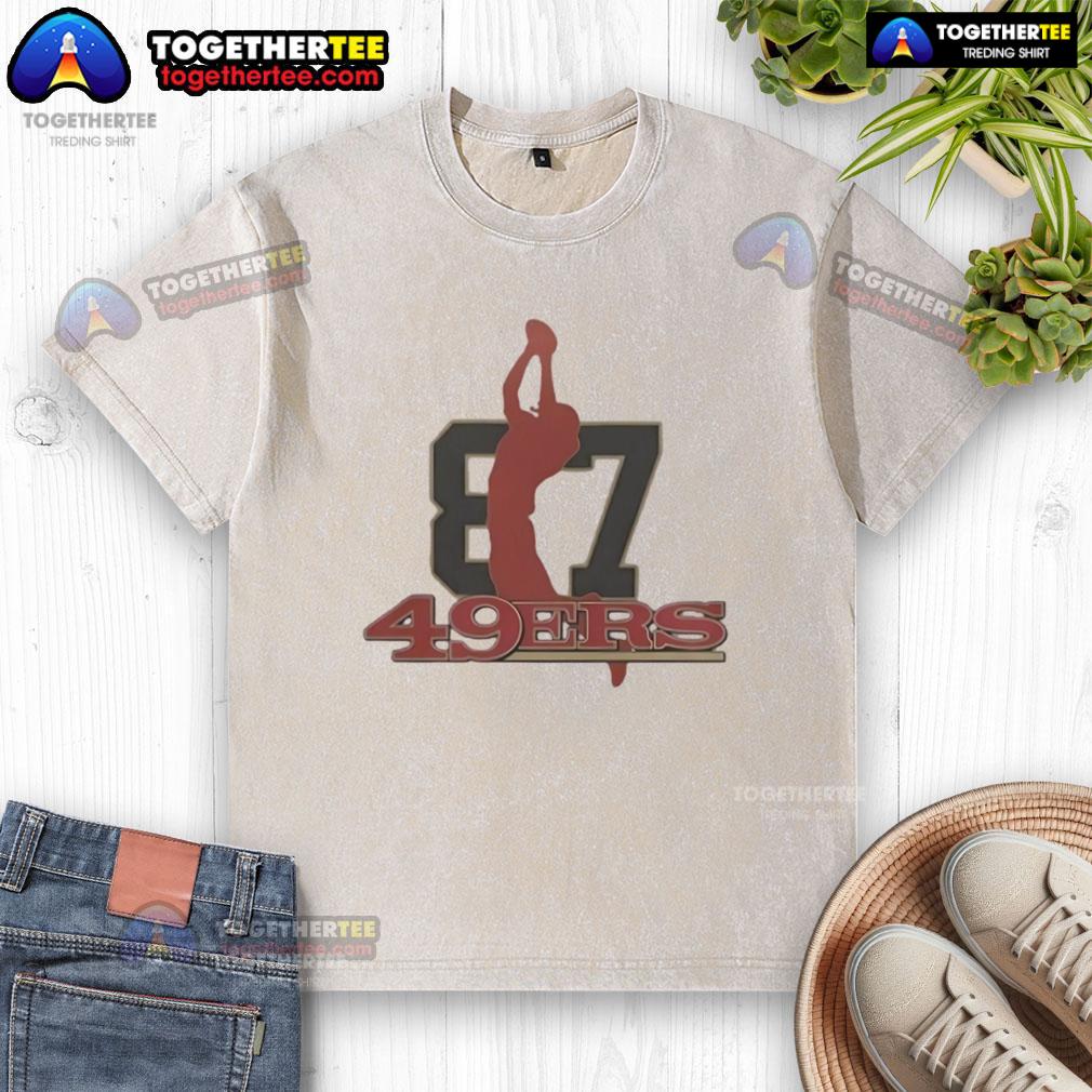 Top 49ers honoring the legacy of Dwight Clark with a vintage washed t-shirt showcasing his iconic catch.