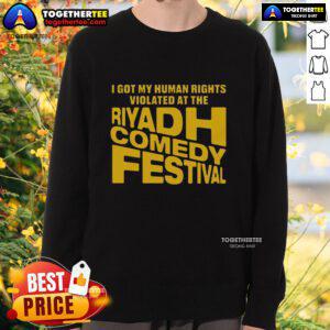 Good I Got My Human Rights Violated sweatshirt at the Riyadh Comedy Festival, showcasing bold humor and cultural commentary.