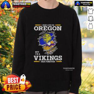 Good I May Live In Oregon But I'm A Minnesota Vikings Fan Forever Sweatshirt showcasing team pride and cozy style.