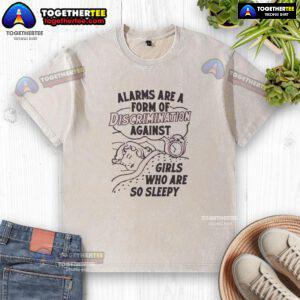 Girl wearing a washed T-shirt with 'Hot Alarms Are A Form Of Discrimination' slogan, highlighting sleepiness and gender bias.