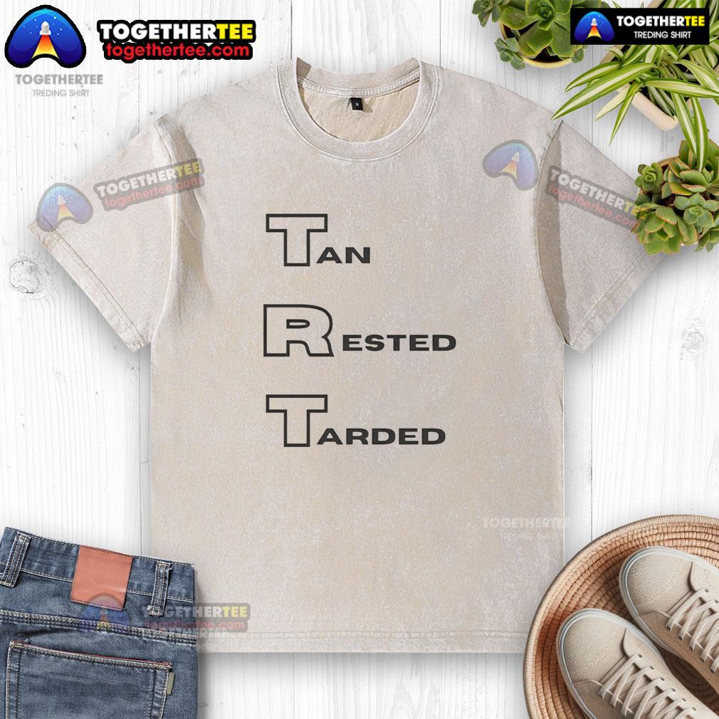 Hot TRT Tan Rested Tarded Washed T-Shirt displayed on a wooden surface, showcasing its soft fabric and casual style.