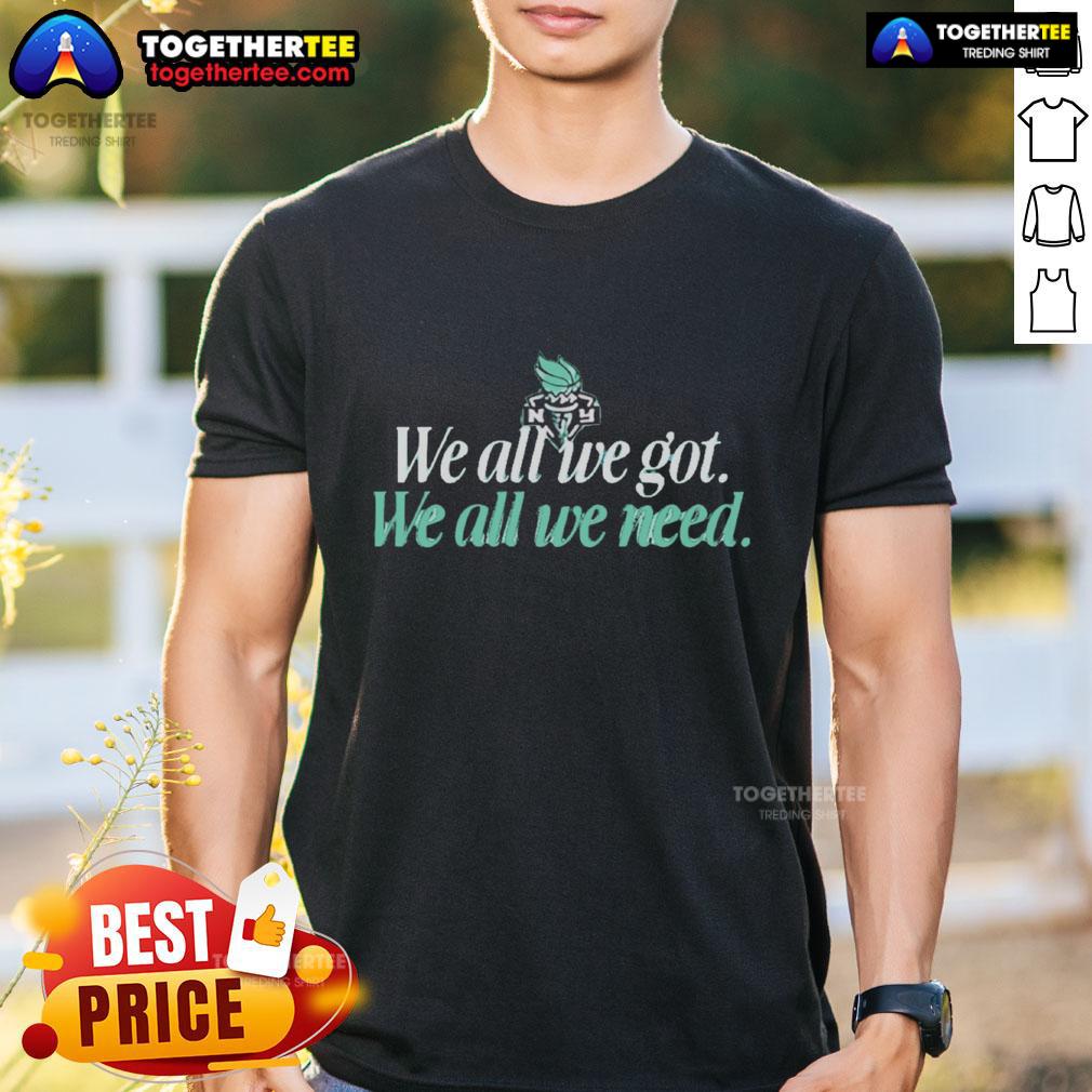 Alt Text: Original We All We Got We All We Need New York Liberty T-Shirt featuring bold graphics and vibrant colors.