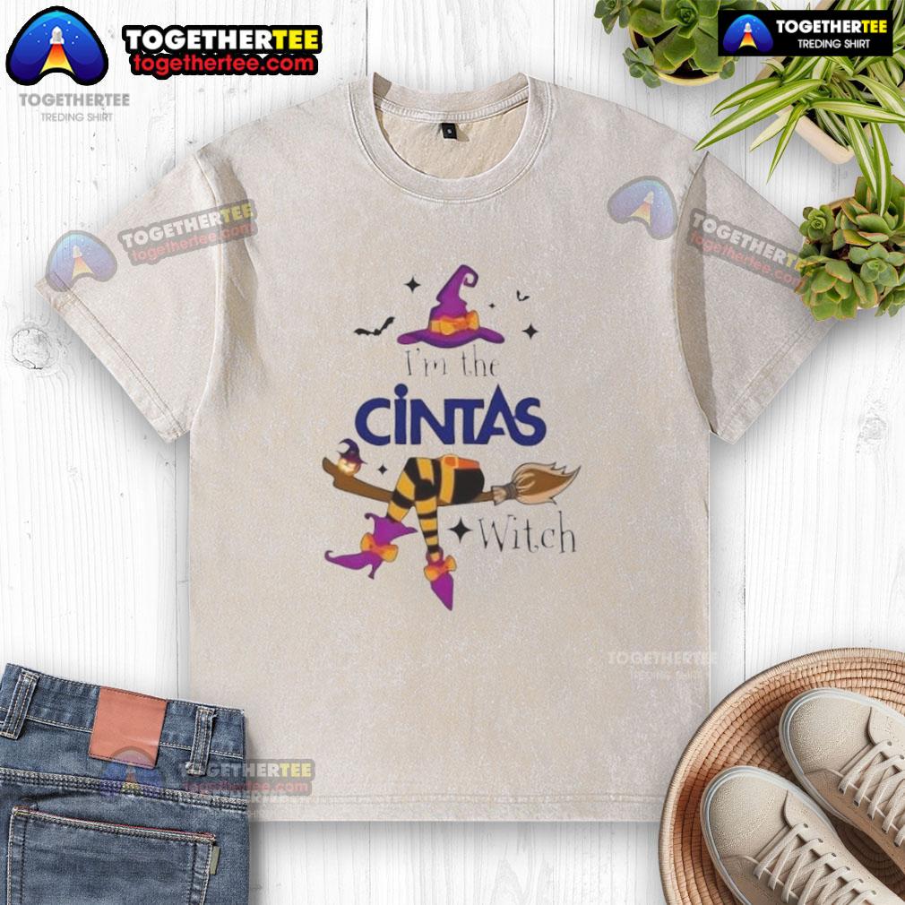 Top Im The Cintas Witch Halloween washed t-shirt featuring a fun witch graphic, perfect for festive Halloween attire.