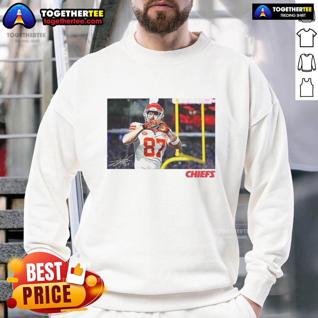 Awesome Travis Kelce Kansas City Chiefs football sweatshirt with heart signature design, perfect for fans.