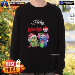 Cute Baby Grinch and Stitch wearing Wendy's Merry Christmas sweatshirt, perfect for holiday celebrations.
