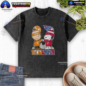Alt Text: Cute Charlie Brown and Snoopy in Tennessee Vols x Titans skyline design on a washed t-shirt, perfect for fans.