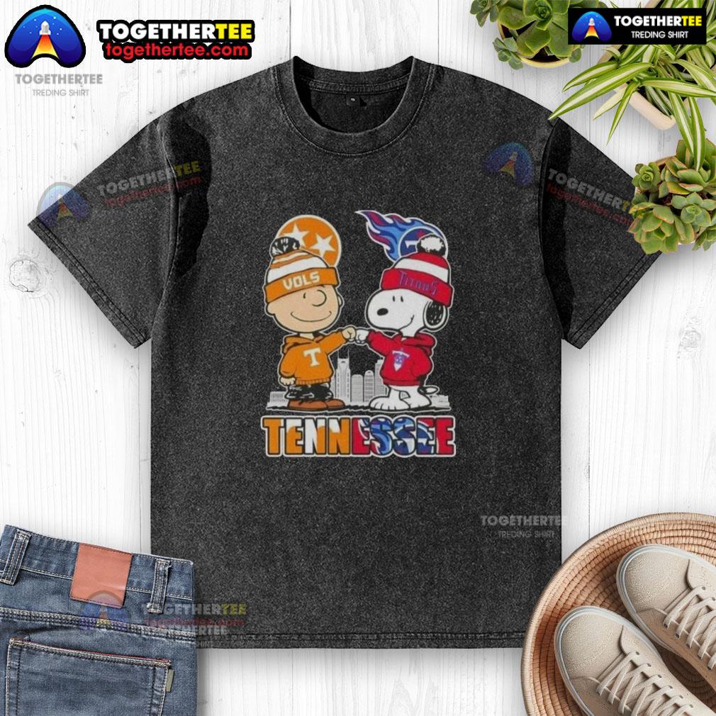 Alt Text: Cute Charlie Brown and Snoopy in Tennessee Vols x Titans skyline design on a washed t-shirt, perfect for fans.