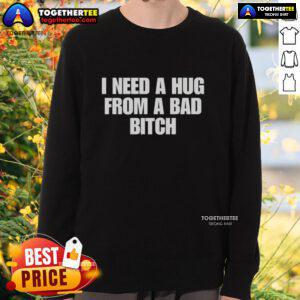 Cozy 'Good I Need A Hug From A Bad Bitch' sweatshirt displayed on a hanger, perfect for casual streetwear fashion.