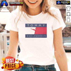 Good Tommy Heilfuhrer logo parody on a ladies tee, featuring bold graphics and a humorous twist on classic designs.