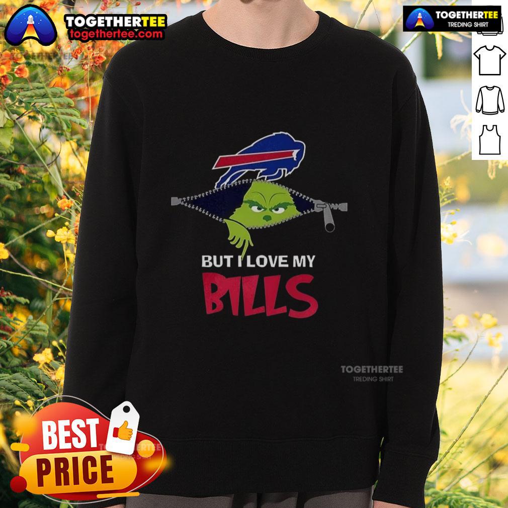 Alt Text: Cheerful person wearing a I Hate People But I Love My Buffalo Bills Grinch sweatshirt for Christmas festivities.