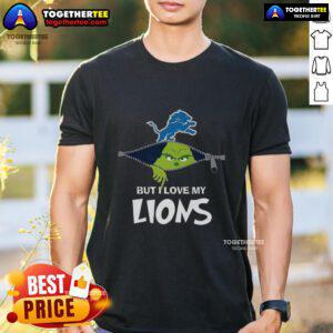 Grinch-themed Christmas T-shirt featuring 'I Hate People But I Love My Detroit Lions' slogan, perfect for football fans.