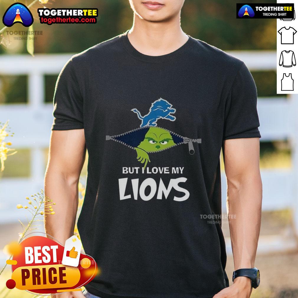 Grinch-themed Christmas T-shirt featuring 'I Hate People But I Love My Detroit Lions' slogan, perfect for football fans.