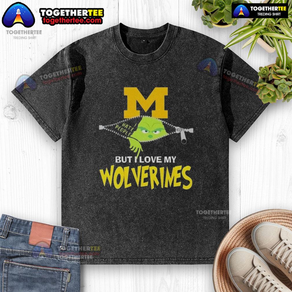 Original Grinch Christmas design on a Michigan Wolverines washed t-shirt, perfect for festive sports fans.