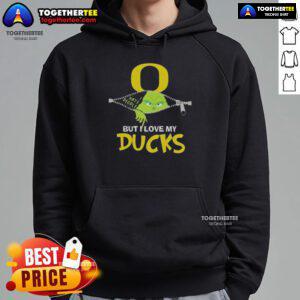 Original Grinch Christmas design featuring a cozy Oregon Ducks hoodie, perfect for festive fans celebrating the holidays.