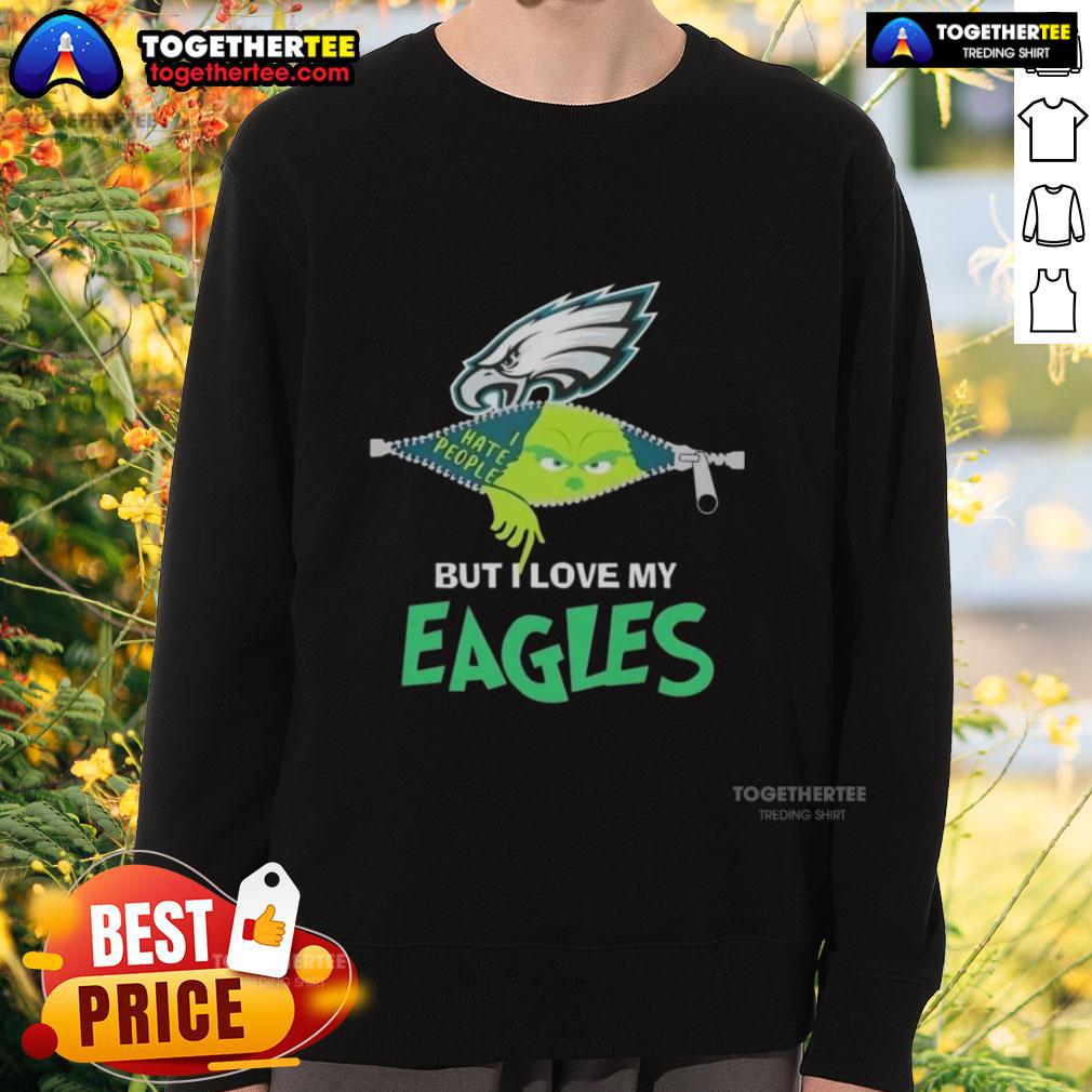 Alt Text: Cozy Original Grinch Christmas sweatshirt featuring love for Philadelphia Eagles in festive colors and design.