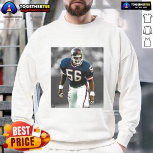 Top Lawrence Taylor New York Giants football sweatshirt featuring team colors and iconic player graphics.