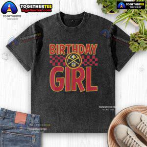 Birthday girl wearing a washed Denver Nuggets t-shirt, celebrating with friends and showing team spirit.