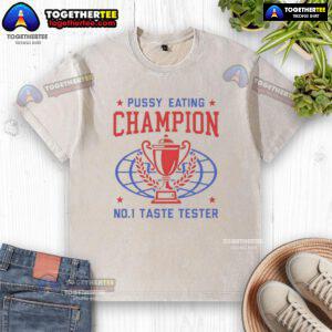 Alt Text: Top Pussy Eating Champion No. 1 Taste Tester trophy on a washed T-shirt, showcasing humor and unique design.