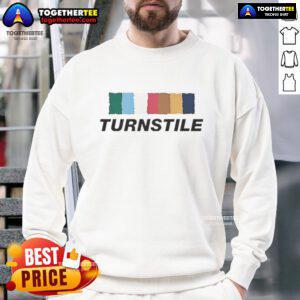 Good Turnstile band sweatshirt in vibrant colors against a wall, perfect for fans of the Sept 2025 music scene.
