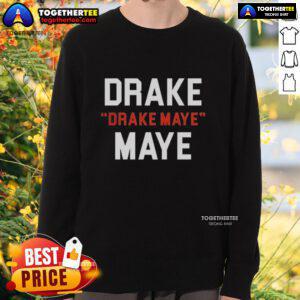 Happy Drake Maye in New England Patriots sweatshirt showcasing his support for the team during football season.