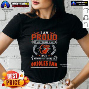 Happy Baltimore Orioles fan wearing a proud ladies tee, showcasing love for the team and passion for baseball.