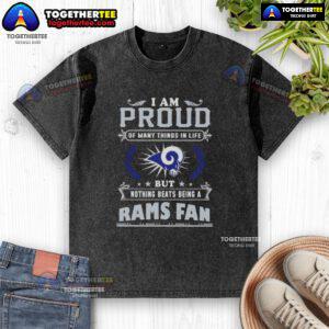 Happy Los Angeles Rams fan wearing a proud, washed T-shirt celebrating team spirit and loyalty.
