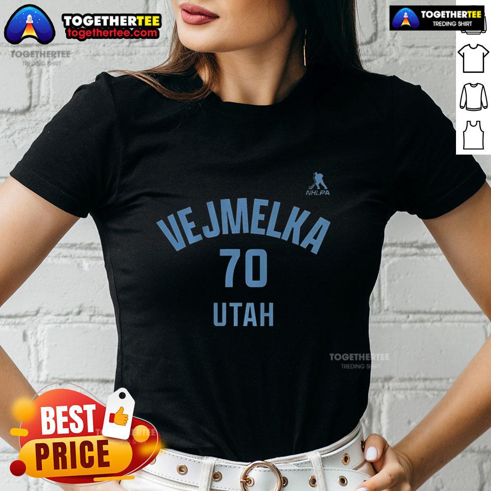 Alt Text: Happy Karel Vejmelka in Utah Mammoth ice hockey ladies tee with name and number 70, showcasing team spirit and style.